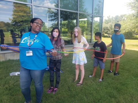 Group of people playing hula hoops