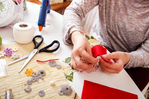 Adult crafting at a table