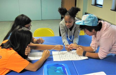 4 teens playing a game