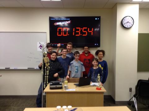 Group of teens playing Escape the Room