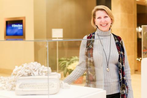 Artist Maggie Kerrigan with her altered book.