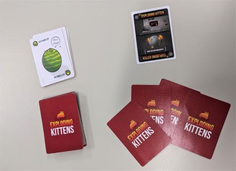 cards from the Exploding Kittens game, with Cattermelon card and Exploding Kitten card showing