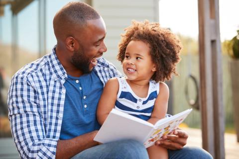 father and daughter reading