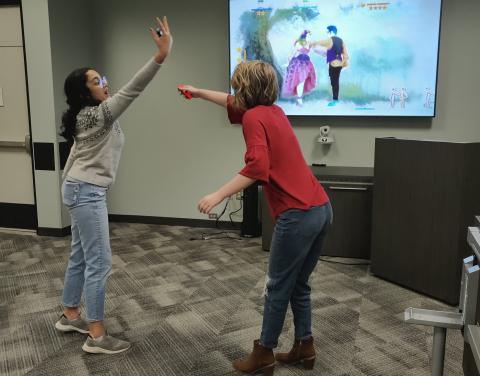 2 teen girls dancing for Just Dance video game