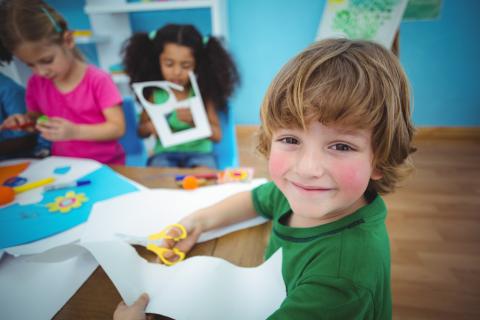 boy cutting paper