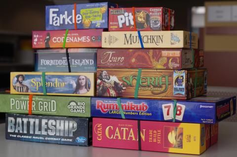 Stack of board games.