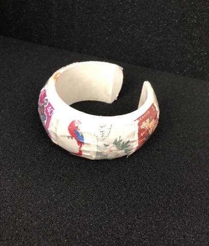 bracelet adorned with stamps