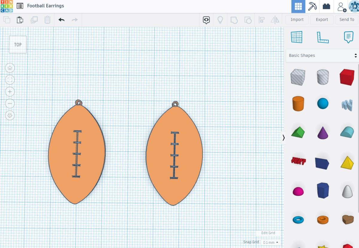 screenshot of Tinkercad program - football earrings