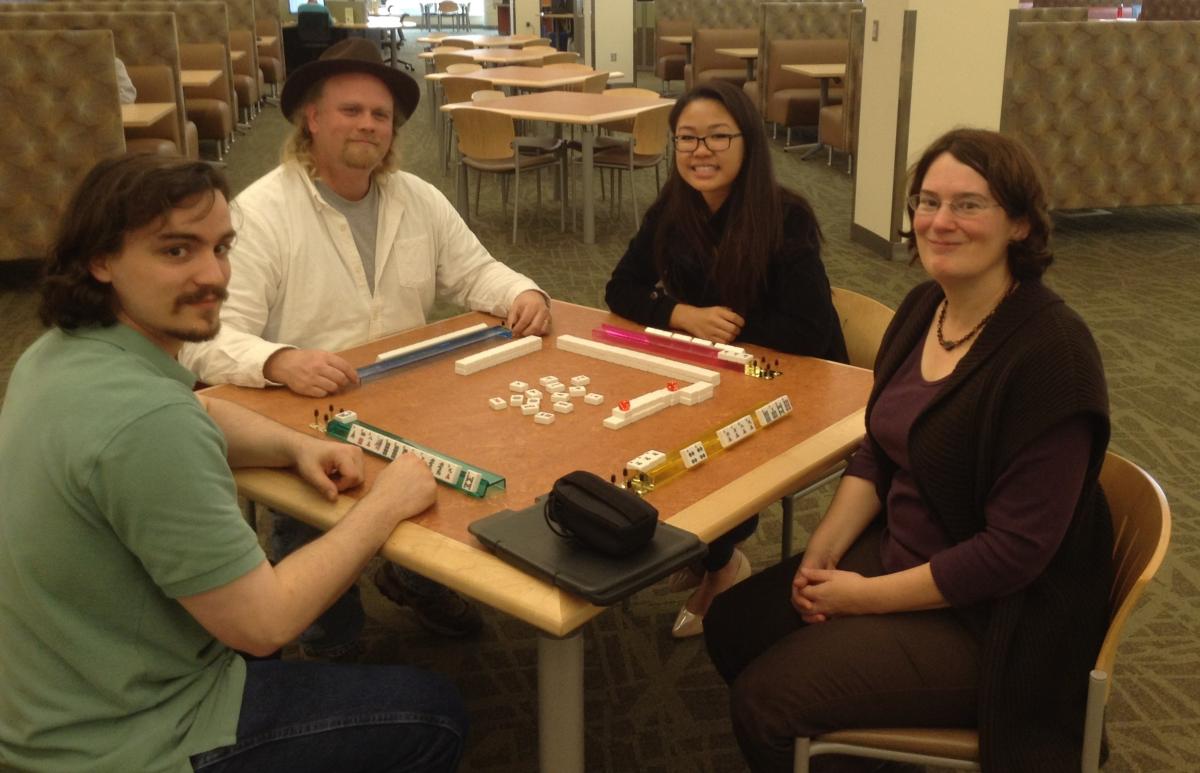 Group of people playing Mahjong