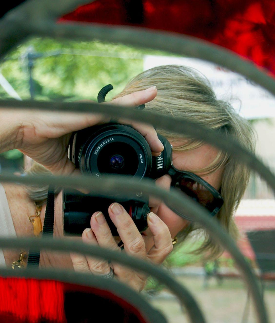 A photograph of Iva Nash with her camera