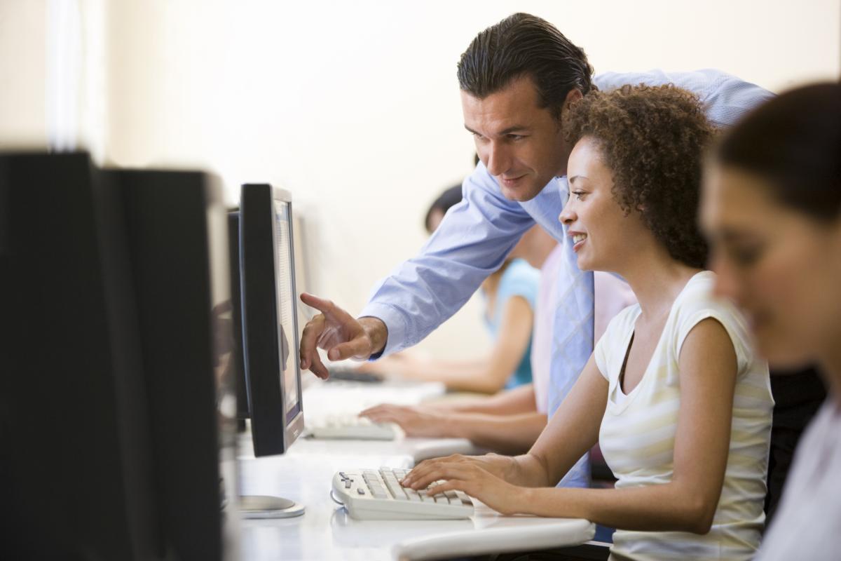 Group of adults taking a computer class