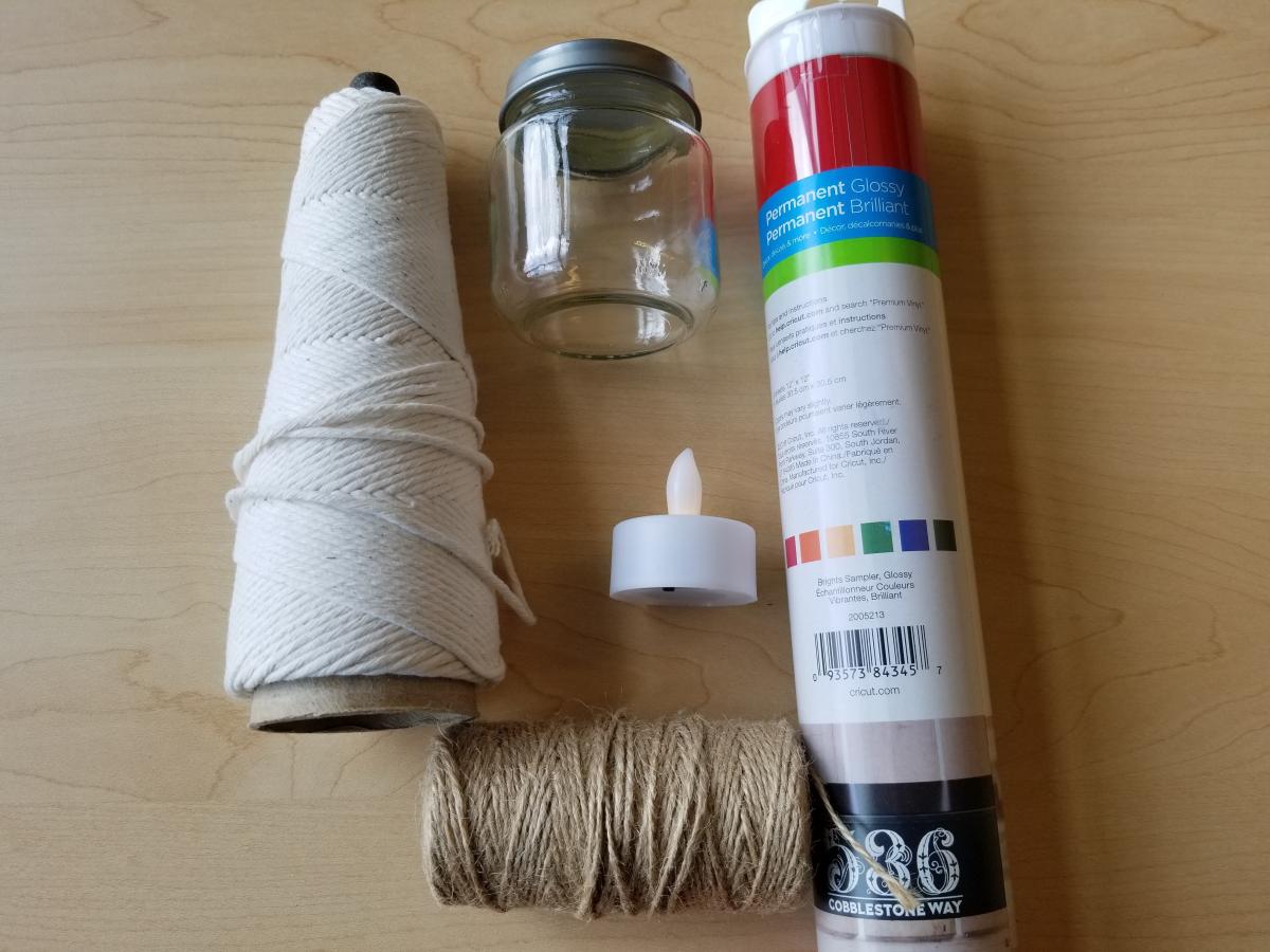 Twine, baby food jar, flameless candle, vinyl