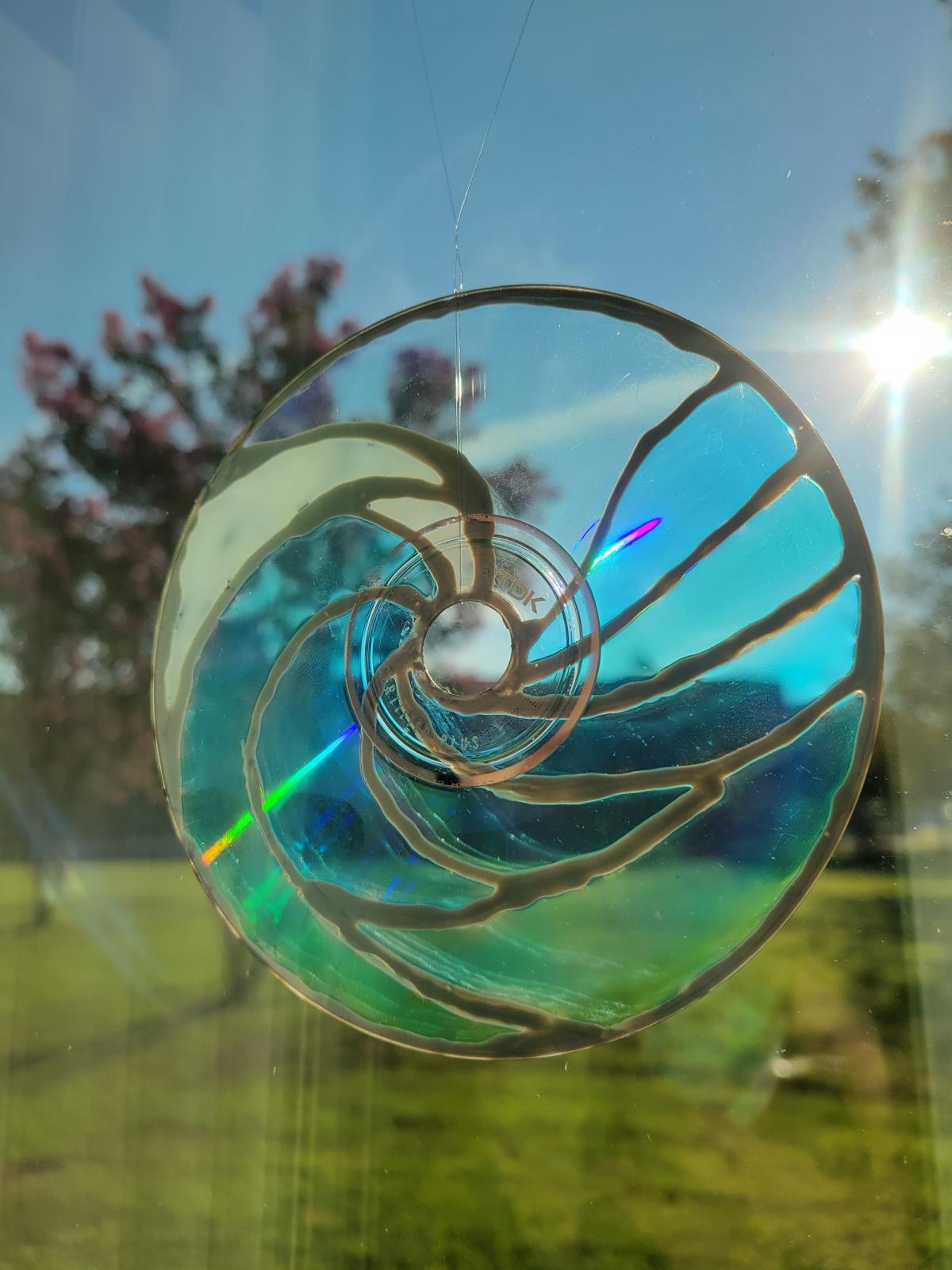 A suncatcher resembling a wave