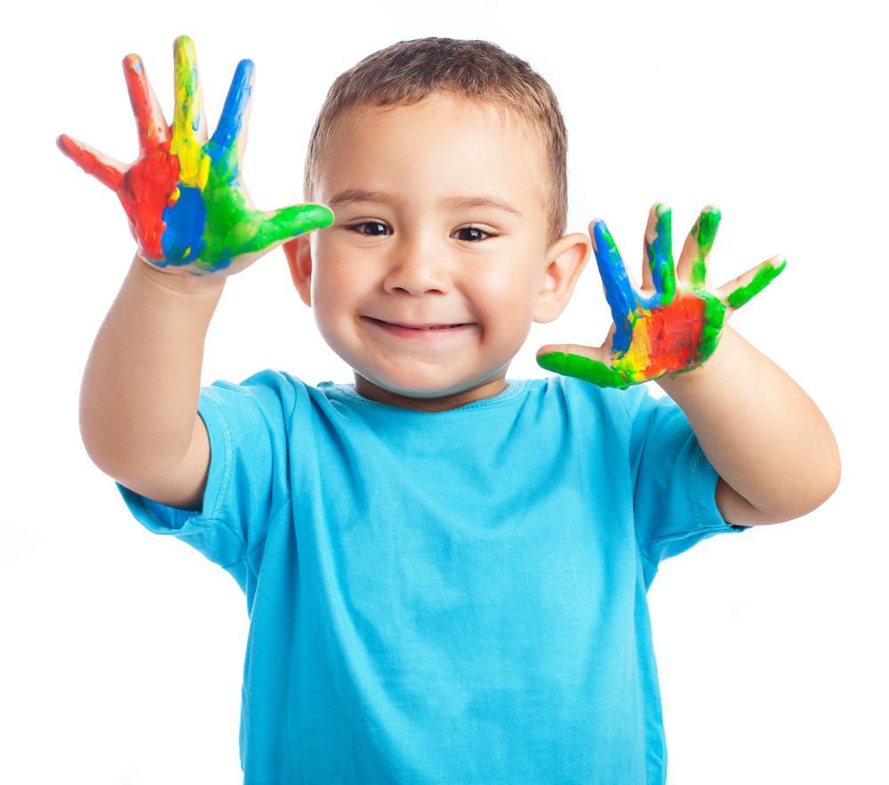 toddler boy with paint on hands