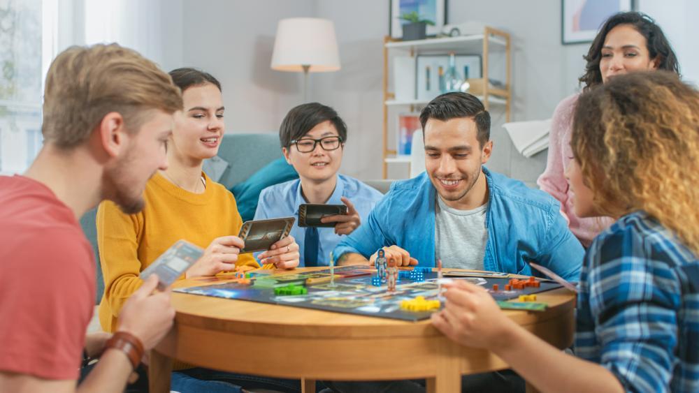 A group of adults playing a board game