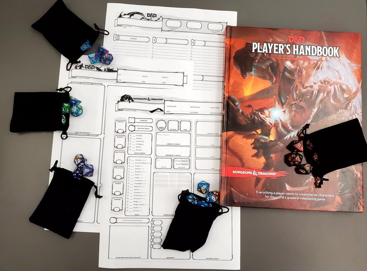 D&D character sheets, dice sets, and manual book