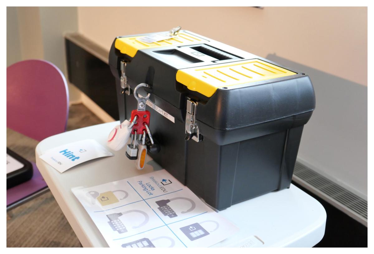 A box with many locks and a yellow lid.