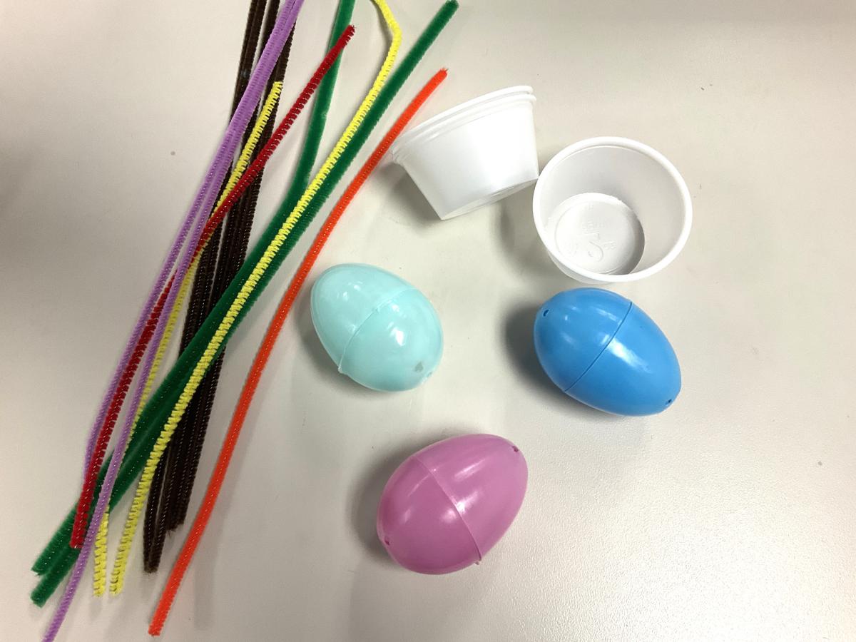 pipe cleaners, plastic eggs, and condiment cups