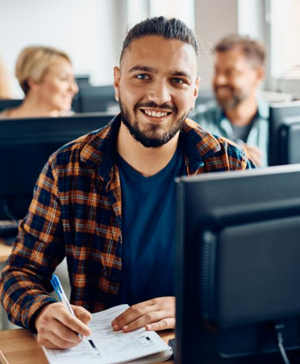 man sitting at computer